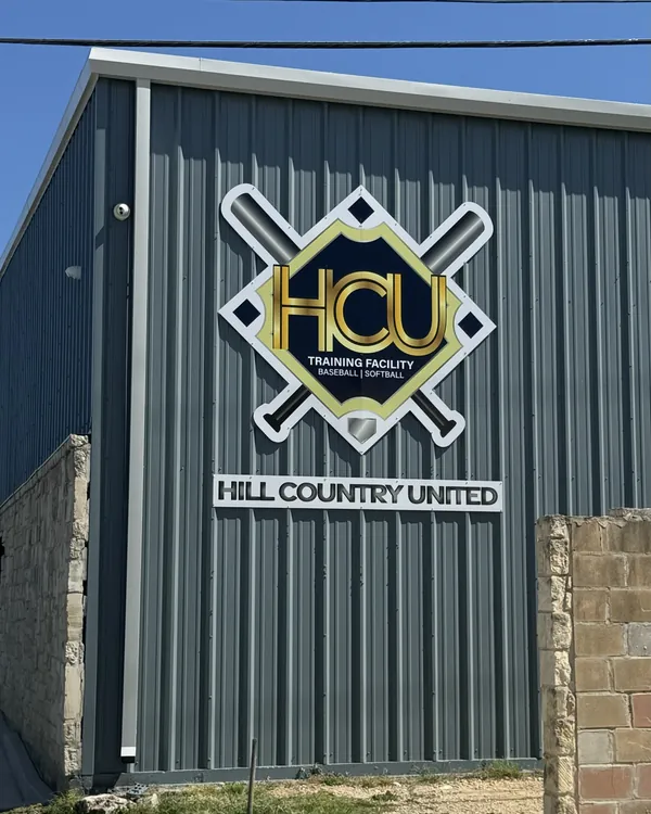 The Hill Country United building in Spring Branch, with the HCU Training Facility, Baseball | Softball sign